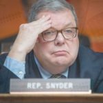 pat snyder with his hand on his forehand