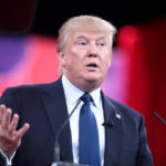 Donald Trump speaking with concerned look on face