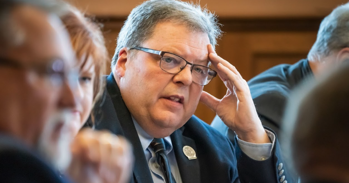 Pat Snyder resting his head on his hand