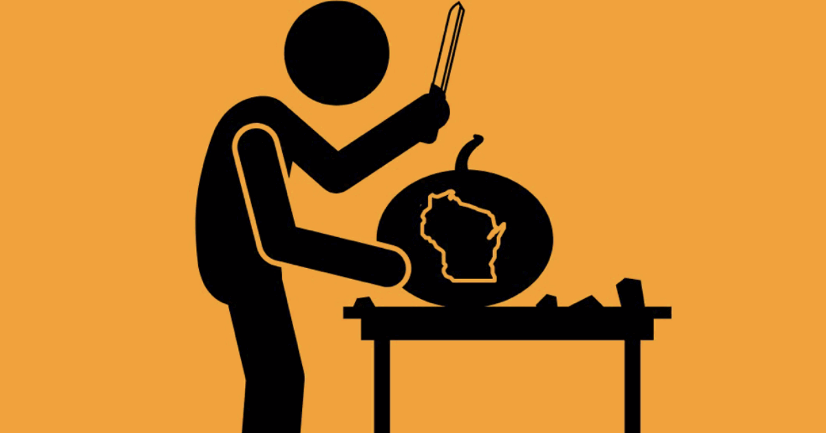 stick figure carving wisconsin into pumpkin