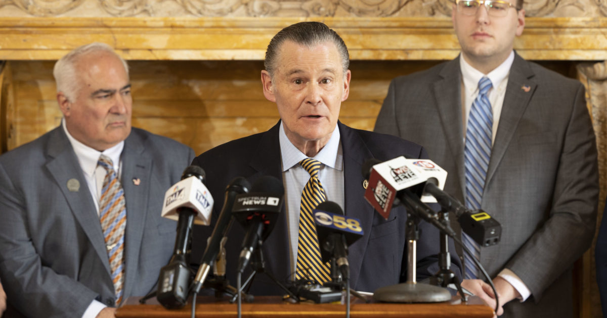Wisconsin State Rep. Bob Donovan standing at podium
