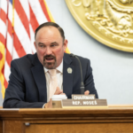 Rep. Clint Moses speaking a dais