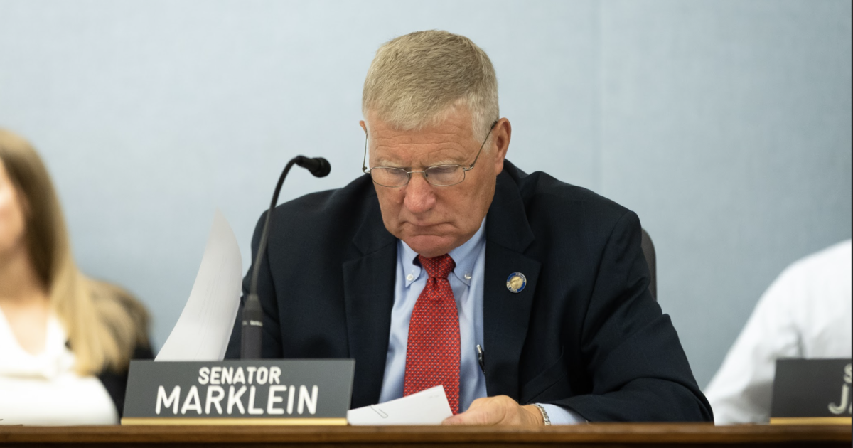 Wisconsin Republican Sen. Howard Marklein looking down at note