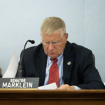 Wisconsin Republican Sen. Howard Marklein looking down at note