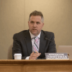 wisconsin republican rep. shannon zimmerman speaking into a microphone