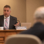 wisconsin republican rep. shannon zimmerman speaking into a microphone