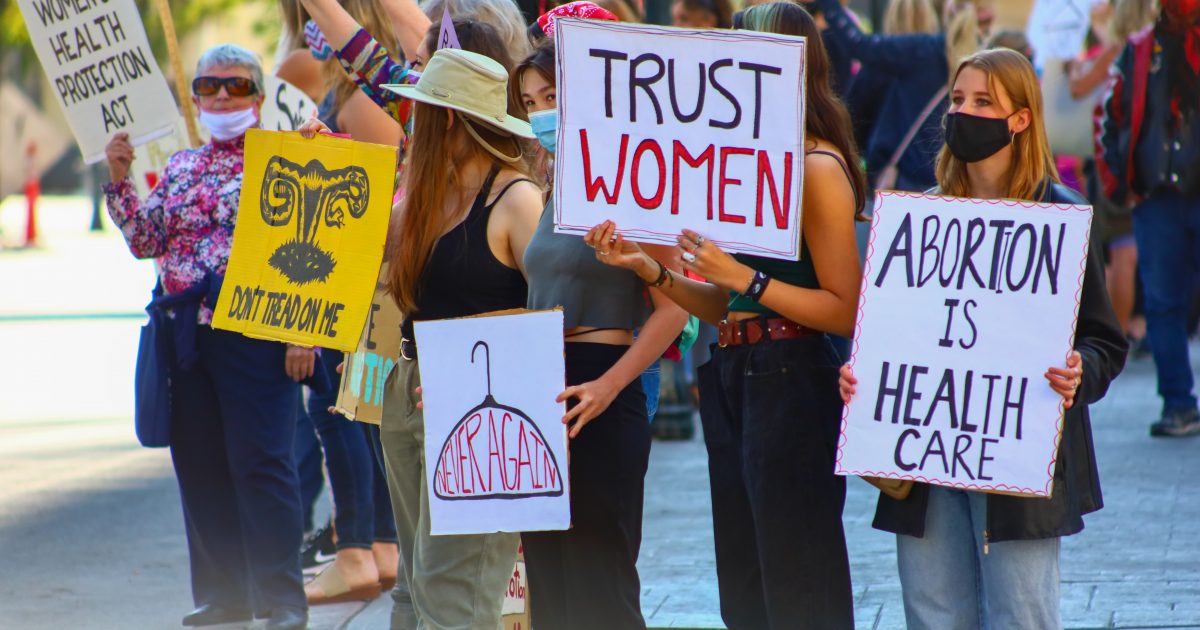 abortion rally with signs supporting women and abortion