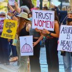 abortion rally with signs supporting women and abortion