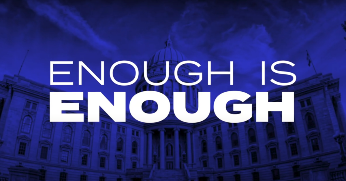 the words enough is enough overlaid on an image of the Wisconsin Capitol Building