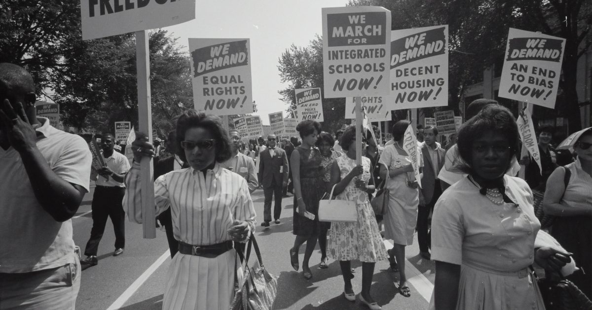 Black Americans marching during the Civil Rights era.