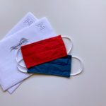 mail-in ballots with a red mask and a blue mask