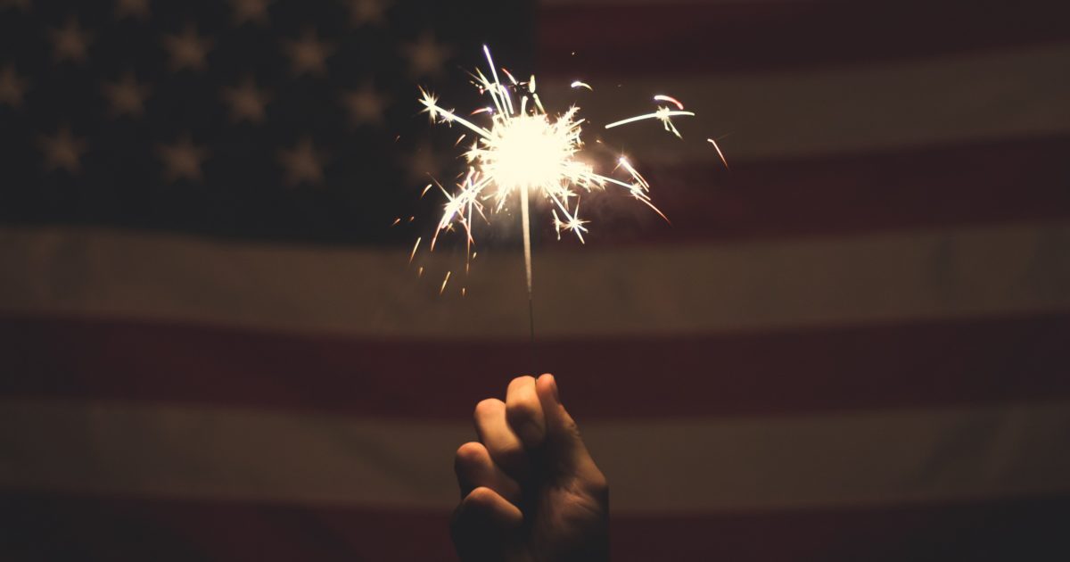 sparkler in front of united states flag